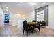 Open concept game room area with a poker table and chairs at 7600 Mackinaw Ln, Kissimmee, FL 34747