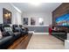 Modern home theater featuring reclining seats and a home entertainment center with popcorn machine at 7600 Mackinaw Ln, Kissimmee, FL 34747