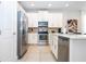 Well-equipped kitchen featuring stainless steel appliances and modern finishes at 7600 Mackinaw Ln, Kissimmee, FL 34747