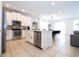 Bright kitchen featuring stainless steel appliances and a connected dining area at 7600 Mackinaw Ln, Kissimmee, FL 34747