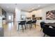 Modern kitchen with white cabinets and a breakfast bar at 7600 Mackinaw Ln, Kissimmee, FL 34747