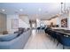 Spacious living area with an open floor plan leading to the kitchen and dining area at 7600 Mackinaw Ln, Kissimmee, FL 34747