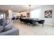 Open-concept living room with dining area and kitchen at 7600 Mackinaw Ln, Kissimmee, FL 34747