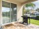 Back patio with a built-in barbeque area, offering plenty of space for outdoor entertaining and dining at 7600 Mackinaw Ln, Kissimmee, FL 34747