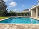 Refreshing private pool and spa with a covered patio, perfect for relaxation and outdoor enjoyment at 7600 Mackinaw Ln, Kissimmee, FL 34747