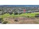 This property offers serene golf course living with lush tree coverage and a green golf course at 1012 Everest St, Clermont, FL 34711