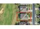 Aerial view of a home with a screened-in lanai situated on a golf course lot at 1012 Everest St, Clermont, FL 34711