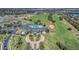Aerial view showcasing the community clubhouse, pool, and meticulously landscaped grounds at 1012 Everest St, Clermont, FL 34711