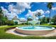 Beautiful water fountain surrounded by manicured hedges in a lovely community setting at 1012 Everest St, Clermont, FL 34711