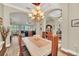 Elegant dining room featuring hardwood floors, stylish lighting, and easy access to other living areas at 1012 Everest St, Clermont, FL 34711