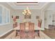 Dining room with a chandelier and a large window at 1012 Everest St, Clermont, FL 34711