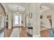 Elegant foyer with wood floors and an arched doorway at 1012 Everest St, Clermont, FL 34711