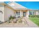 Home's entrance featuring a decorative fountain, and manicured landscaping at 1012 Everest St, Clermont, FL 34711