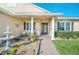 Inviting front entrance featuring a beautiful fountain and a cozy seating area at 1012 Everest St, Clermont, FL 34711