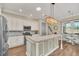 Bright kitchen with granite countertops, stainless steel appliances, and hardwood floors at 1012 Everest St, Clermont, FL 34711