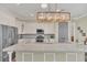 Kitchen with a large granite countertop island, stainless steel appliances, and recessed lighting at 1012 Everest St, Clermont, FL 34711