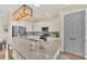 Kitchen with stainless steel appliances, granite countertop island, and a pantry door at 1012 Everest St, Clermont, FL 34711