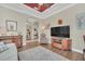 Comfortable living room showcasing wood floors, a media center, and a decorative accent wall at 1012 Everest St, Clermont, FL 34711