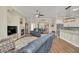 Open living area with a kitchen, fireplace, and comfortable seating, designed for entertaining at 1012 Everest St, Clermont, FL 34711