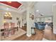 Open-concept living and dining areas with wood floors and lots of natural light at 1012 Everest St, Clermont, FL 34711
