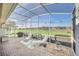 Enjoy relaxing views of the lush golf course from this screened outdoor patio at 1012 Everest St, Clermont, FL 34711