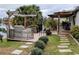 Spacious backyard with patio, grill, and lake access at 124 Hollyhock Ct, Kissimmee, FL 34743