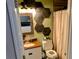 Bathroom with hexagon wall decor and updated vanity at 124 Hollyhock Ct, Kissimmee, FL 34743