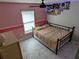 Bedroom with full-size bed and ceiling fan at 124 Hollyhock Ct, Kissimmee, FL 34743