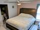 King-size bed in main bedroom with ensuite bathroom at 124 Hollyhock Ct, Kissimmee, FL 34743