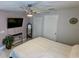 Main bedroom with ceiling fan, large bed, and ensuite bathroom at 124 Hollyhock Ct, Kissimmee, FL 34743