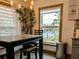 Bright dining area with lake view and modern light fixtures at 124 Hollyhock Ct, Kissimmee, FL 34743
