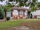 Charming curb appeal with rocking chairs and well-manicured lawn at 124 Hollyhock Ct, Kissimmee, FL 34743