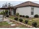 House exterior showcasing a side view and landscaping at 124 Hollyhock Ct, Kissimmee, FL 34743