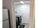 Laundry room with washer, dryer, and extra storage at 124 Hollyhock Ct, Kissimmee, FL 34743
