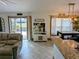 Open living space with kitchen and patio access at 124 Hollyhock Ct, Kissimmee, FL 34743