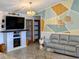 Living room with geometric wall art and fireplace at 124 Hollyhock Ct, Kissimmee, FL 34743