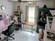 Bright and spacious home office features built-in shelving and window at 124 Hollyhock Ct, Kissimmee, FL 34743