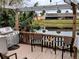 Outdoor kitchen and dining area with lake view at 124 Hollyhock Ct, Kissimmee, FL 34743
