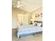 Spacious bedroom with a queen-size bed and ensuite bathroom at 124 Lancaster Dr, Davenport, FL 33897