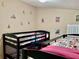 Bedroom with two sets of bunk beds, ideal for children at 124 Lancaster Dr, Davenport, FL 33897