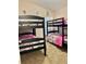Bedroom with two sets of bunk beds, ideal for children at 124 Lancaster Dr, Davenport, FL 33897
