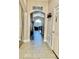 Bright and spacious entryway with tile flooring and views to the living room at 124 Lancaster Dr, Davenport, FL 33897