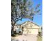 Well-maintained single-story home with a two-car garage and brick-paved driveway at 124 Lancaster Dr, Davenport, FL 33897