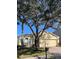 House exterior showcasing a two-car garage and landscaping at 124 Lancaster Dr, Davenport, FL 33897
