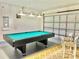 Fun game room with pool table and seating at 124 Lancaster Dr, Davenport, FL 33897