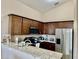 Modern kitchen with granite countertops and stainless steel appliances at 124 Lancaster Dr, Davenport, FL 33897