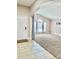 Spacious living room with large windows and neutral carpeting at 124 Lancaster Dr, Davenport, FL 33897