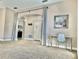Living area with gray carpet and a home office setup at 124 Lancaster Dr, Davenport, FL 33897