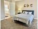 Serene main bedroom with a comfortable bed and neutral color palette at 124 Lancaster Dr, Davenport, FL 33897