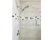 Modern shower with stylish tile and a rainfall shower head at 124 Lancaster Dr, Davenport, FL 33897